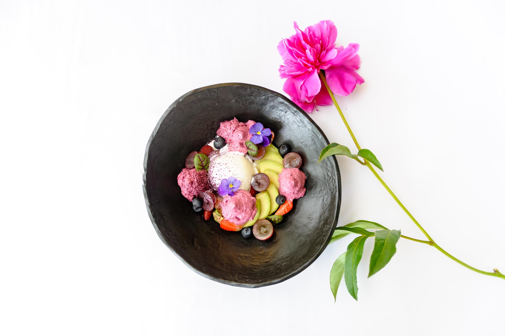 Close-up plated dessert with edible flowers