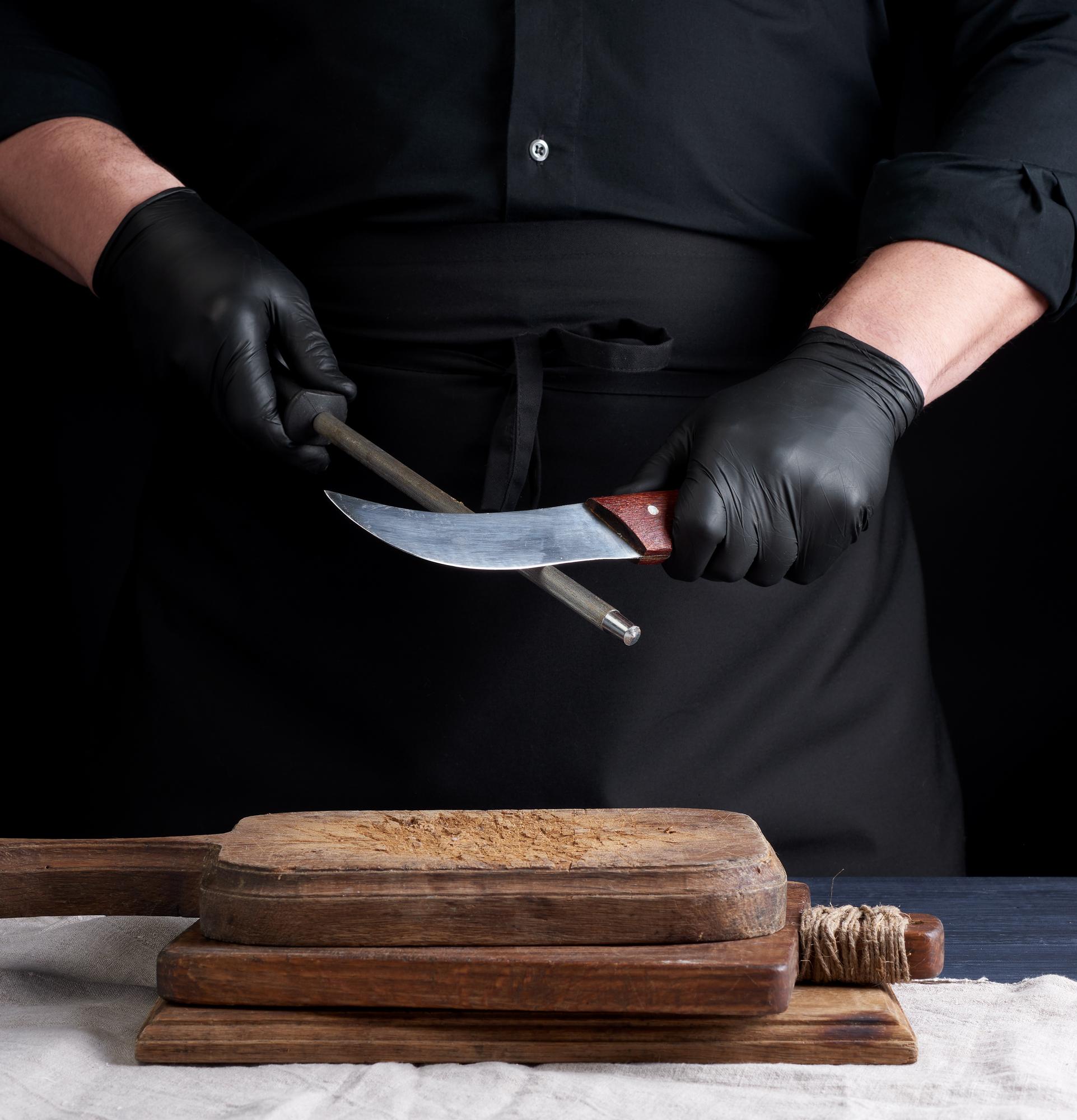Chef demonstrating knife technique in studio